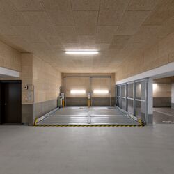 Système de stationnement escamotable dans un parking souterrain