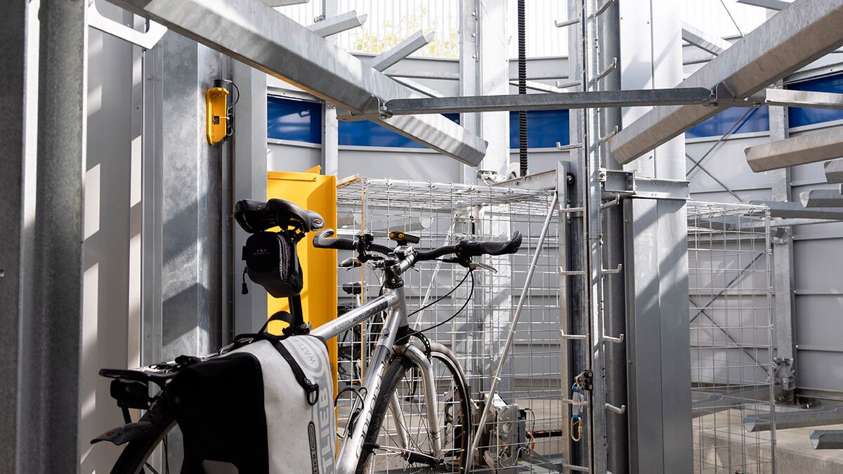 Bicycle on a rail in an automatic bicycle parking system