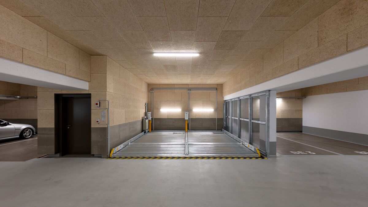 Système de stationnement escamotable dans un parking souterrain
